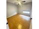 Bedroom with tile floors, a ceiling fan, and window, offers a comfortable and simple space at 12112 Shallot St, Orlando, FL 32837