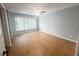 Neutral bedroom with tile floors, ceiling fan, and a window at 12112 Shallot St, Orlando, FL 32837