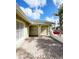 A covered brick carport provides sheltered parking and architectural detail at 12112 Shallot St, Orlando, FL 32837