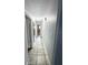 Hallway features ceramic tile and provides access to bedrooms and bathrooms at 12112 Shallot St, Orlando, FL 32837