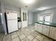 Kitchen features ceramic tile, ample counter space, and white cabinetry at 12112 Shallot St, Orlando, FL 32837