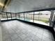 Enclosed patio with tile flooring overlooking the backyard pool at 12112 Shallot St, Orlando, FL 32837