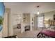 Bright bedroom with a window, carpeted floors, built-in desk, and mirrored closet doors at 12202 Rambling Oak Blvd, Orlando, FL 32832