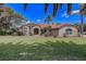 Charming brick home with lush lawn, mature trees, and inviting curb appeal at 12202 Rambling Oak Blvd, Orlando, FL 32832