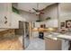Updated kitchen features granite countertops, stainless steel appliances, and ample cabinet space at 12202 Rambling Oak Blvd, Orlando, FL 32832