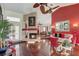 Living room featuring hardwood floors, fireplace, and bright, airy atmosphere at 12202 Rambling Oak Blvd, Orlando, FL 32832