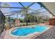 Inviting screened-in pool and spa area, perfect for outdoor relaxation and entertaining at 12202 Rambling Oak Blvd, Orlando, FL 32832