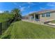 A lush green yard featuring a fenced pool and seating area, great for relaxation at 12289 Prairie Plantation Way, Orlando, FL 32824