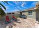A serene backyard featuring a patio with a kitchen and a long, inviting pool at 12289 Prairie Plantation Way, Orlando, FL 32824