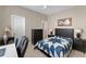 Cozy bedroom with star patterned quilt, tile floors, desk and ample storage space at 12289 Prairie Plantation Way, Orlando, FL 32824