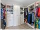 Walk-in closet with custom shelving, drawers, and storage cabinets for organized storage at 12289 Prairie Plantation Way, Orlando, FL 32824