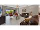 Bright living room featuring comfortable couches, stylish decor, and sliding glass doors that offer a view of the backyard at 12289 Prairie Plantation Way, Orlando, FL 32824