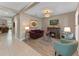 Comfortable living room with fireplace, stylish decor, and tile/wood flooring, creating a warm and inviting atmosphere at 12289 Prairie Plantation Way, Orlando, FL 32824