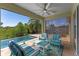 Covered patio featuring an outdoor kitchen and a view of the pool and backyard at 12289 Prairie Plantation Way, Orlando, FL 32824