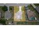 An aerial view shows the property and its boundaries, with a long driveway and nearby parking at 1233 Nelson Park Court, Poinciana, FL 34759
