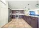 Well-equipped kitchen features ample counter space, stainless steel appliances, and modern finishes at 1233 Nelson Park Court, Poinciana, FL 34759