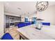 Open concept kitchen with dark cabinets, stainless steel appliances, and a breakfast bar with seating at 1233 Nelson Park Court, Poinciana, FL 34759
