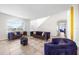 Spacious living room area features tile floors and modern furnishings at 1233 Nelson Park Court, Poinciana, FL 34759