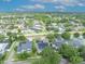 High-angle aerial shot showing a house in a Gathering-friendly neighborhood with solar panels and tree-lined streets at 13505 Phoenix Dr, Orlando, FL 32828