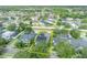 Aerial view shows a home with solar panels, a screened pool, and a well-maintained yard inside property lines at 13505 Phoenix Dr, Orlando, FL 32828