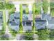 A bird's-eye view showcases a home featuring a pool, trampoline, and solar panels, all within a well-defined property line at 13505 Phoenix Dr, Orlando, FL 32828
