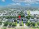 An aerial view shows the property nestled in a verdant neighborhood, highlighted by a locator pin for easy identification at 13505 Phoenix Dr, Orlando, FL 32828