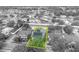 An overhead shot highlights the property lines of a house featuring solar panels, a private pool, and lush landscaping at 13505 Phoenix Dr, Orlando, FL 32828