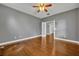 Inviting bedroom featuring hardwood floors, natural light, and a ceiling fan at 13505 Phoenix Dr, Orlando, FL 32828