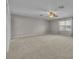 Spacious, neutral bedroom with carpet, a ceiling fan, large windows, and sheer curtains at 13505 Phoenix Dr, Orlando, FL 32828