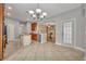 Open kitchen view showcasing an island, ample cabinetry, and access to the living area at 13505 Phoenix Dr, Orlando, FL 32828