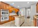 Well-equipped kitchen with stainless steel appliances, granite countertops, and ample cabinetry at 13505 Phoenix Dr, Orlando, FL 32828