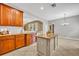 Stylish kitchen with a center island, granite countertops, stainless steel appliances and tile flooring at 13505 Phoenix Dr, Orlando, FL 32828