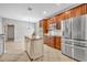 View of the kitchen showing stainless steel appliances, granite countertops, and a center island at 13505 Phoenix Dr, Orlando, FL 32828