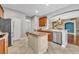 Bright kitchen showcasing an island with granite countertop and stainless steel appliances at 13505 Phoenix Dr, Orlando, FL 32828