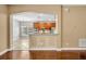 Kitchen view from living space, featuring granite countertops and breakfast bar at 13505 Phoenix Dr, Orlando, FL 32828