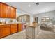 Stylish kitchen with a center island, granite countertops, stainless steel appliances and tile flooring at 13505 Phoenix Dr, Orlando, FL 32828
