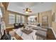 Cozy living room with hardwood floors, natural light, neutral colors and ceiling fan at 13505 Phoenix Dr, Orlando, FL 32828