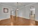 An inviting living room with hardwood floors, neutral walls, and elegant arched doorways at 13505 Phoenix Dr, Orlando, FL 32828