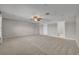 Large living room features neutral paint and plush carpet flooring at 13505 Phoenix Dr, Orlando, FL 32828