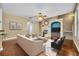 Inviting living room with hardwood floors, fireplace, comfortable seating, and natural light at 13505 Phoenix Dr, Orlando, FL 32828