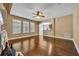 Spacious living room with hardwood floors, natural light, and neutral decor at 13505 Phoenix Dr, Orlando, FL 32828
