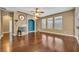 Charming living room with hardwood floors, a fireplace, and natural light at 13505 Phoenix Dr, Orlando, FL 32828