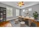 Bright office space featuring hardwood floors, shutters, stylish decor and a ceiling fan at 13505 Phoenix Dr, Orlando, FL 32828