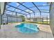 An inviting in-ground pool is surrounded by a screened enclosure for outdoor enjoyment and privacy at 13505 Phoenix Dr, Orlando, FL 32828