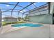 A refreshing in-ground pool nestled within a screened enclosure, creating a private outdoor oasis at 13505 Phoenix Dr, Orlando, FL 32828