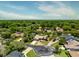 Aerial view of the home showing the property lines and surrounding mature trees at 140 Margate Mews, Longwood, FL 32779