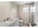 Updated bathroom features marble countertop and tiled walk-in shower at 140 Margate Mews, Longwood, FL 32779