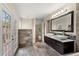 Modern bathroom featuring a double vanity and french doors to the exterior at 140 Margate Mews, Longwood, FL 32779