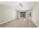 Spacious bedroom with ceiling fan and sliding glass door to backyard patio at 140 Margate Mews, Longwood, FL 32779