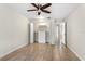 Well lit bedroom with open closet, tile flooring, and neutral paint color at 140 Margate Mews, Longwood, FL 32779